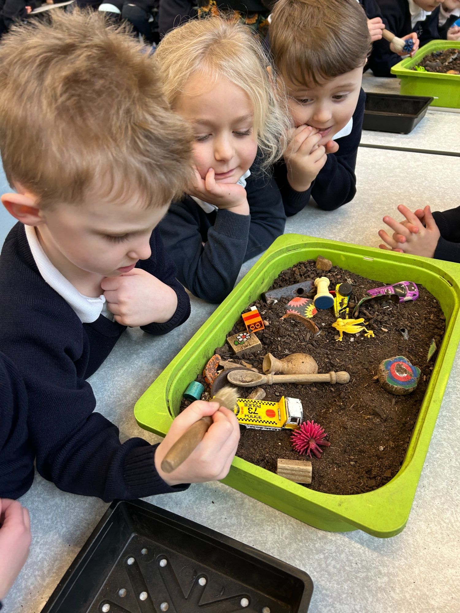Image to show children being archeologists